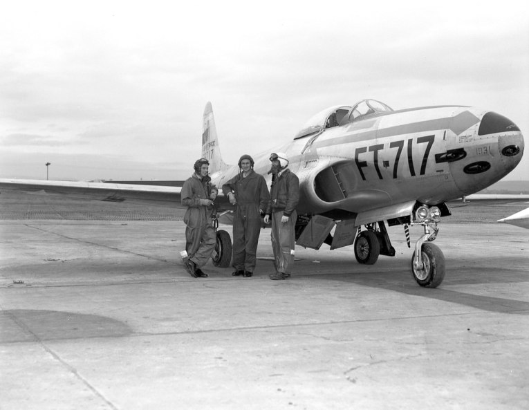 RAF pilots and their USAF counterpart exchanging pleasantries alongside an F-80 (54-8717) of the 36th Fighter Bomber Group. This aircraft crashed in 1952.