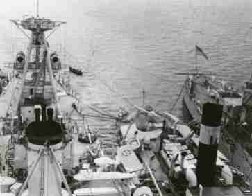 O2Us aboard USS Chester. She and USS Indianapolis (R) are seen refueling from the tanker USS Salinas while enroute to South America in 1936.
